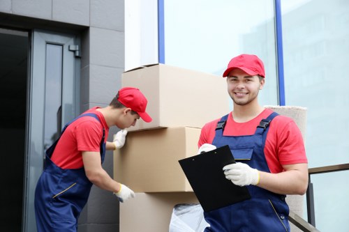 Team loading moving boxes safely into a van