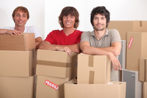 Packed office equipment ready for transport during a Balham business move