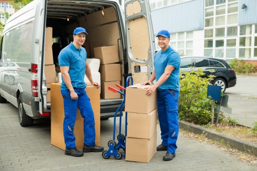 Balham packing service handling boxes in a residential flat