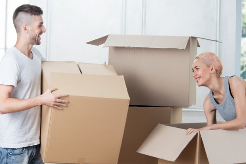 Worker carrying a box carefully during a move