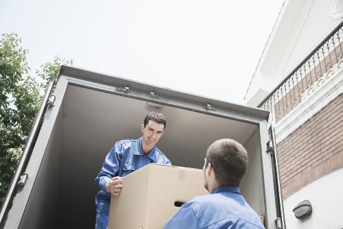 Loading boxes and household items into a van in Balham