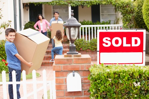 House removalists carrying furniture from a Balham flat