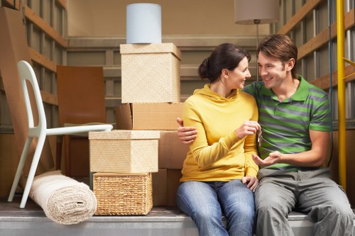 Careful transport of a sofa and table during a Balham move