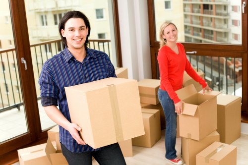 Local removals team handling furniture and boxes in Balham